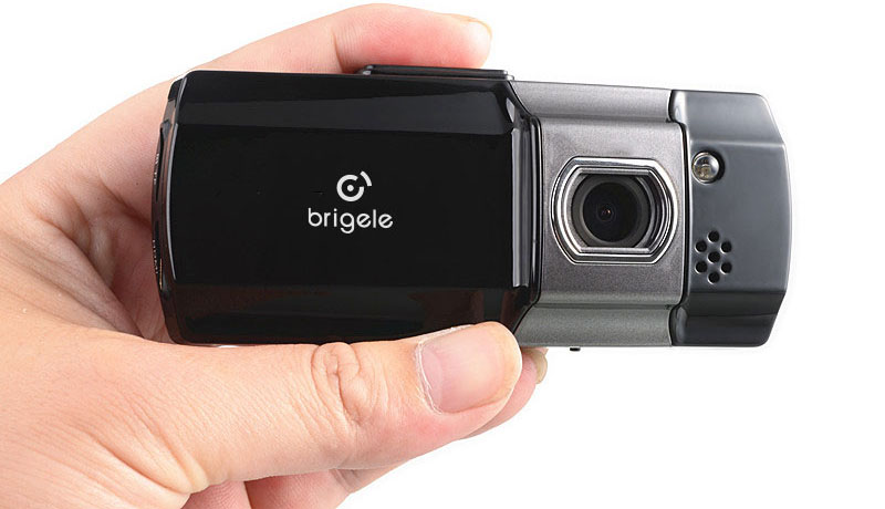 A hand holding Brigele DR 2100 compact dash cam